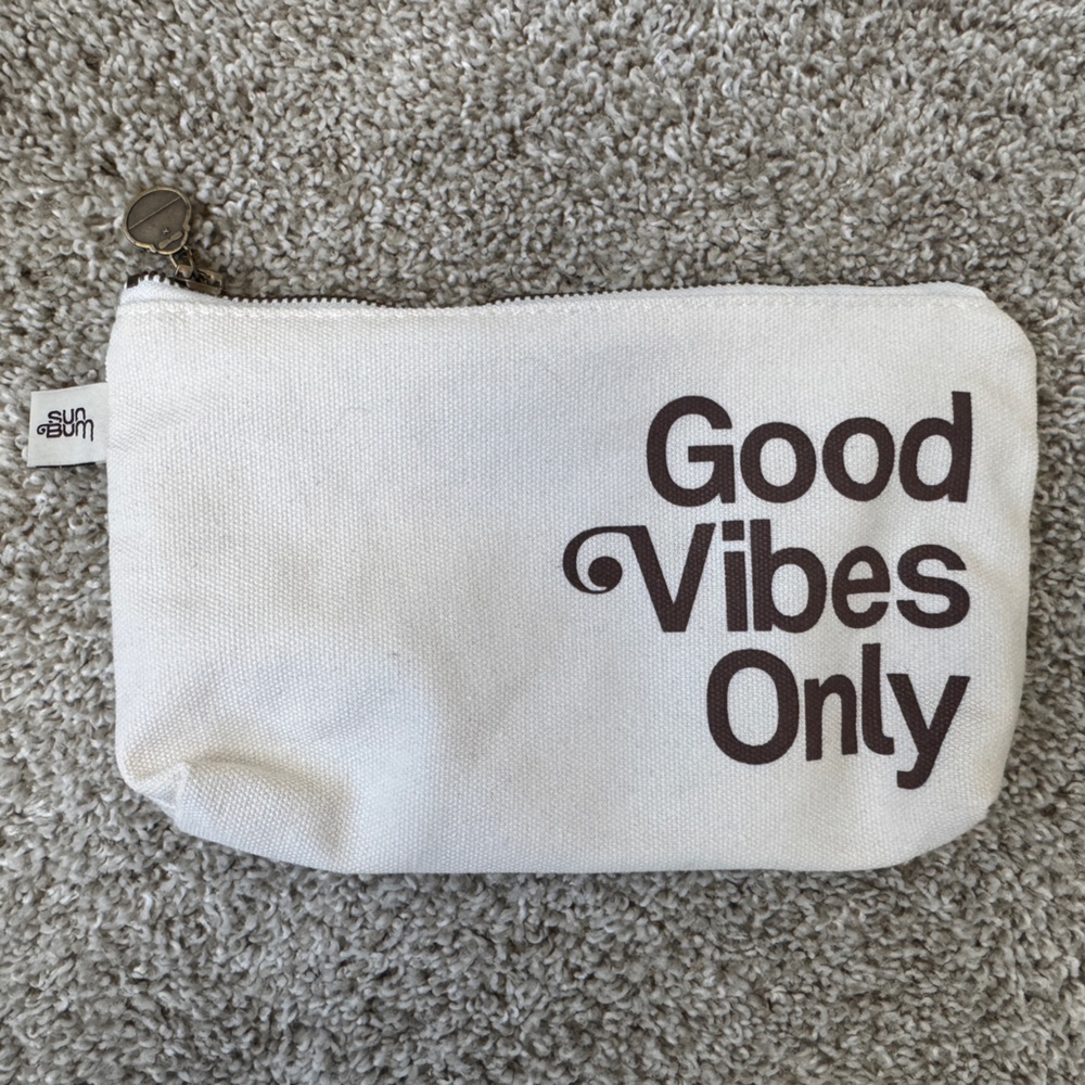 Cream Pouch with Bold Brown Text